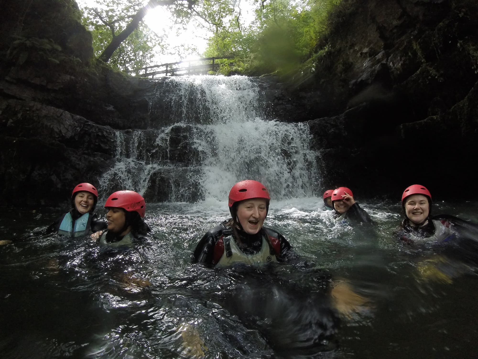 Group swimming in a plunge pool on their gorge walking activity
