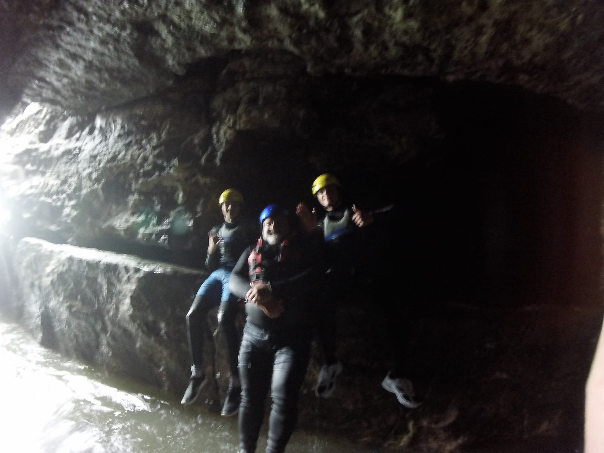 Group exploring the caves whilst coasteering