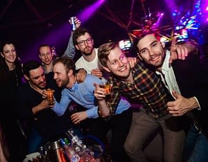 Group of lads in a nightclub during a stag party in Porthcawl
