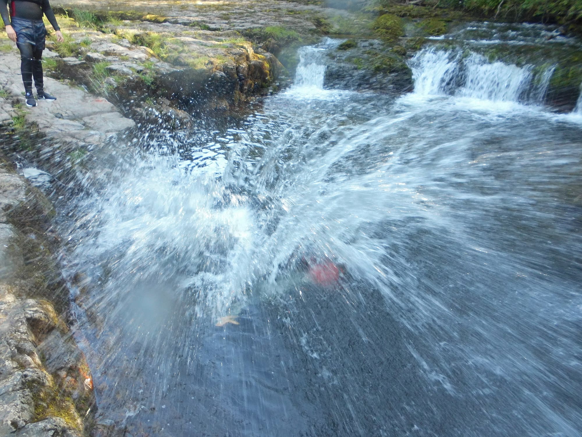 Wild swimming through white water in Brecon Beacons National Park